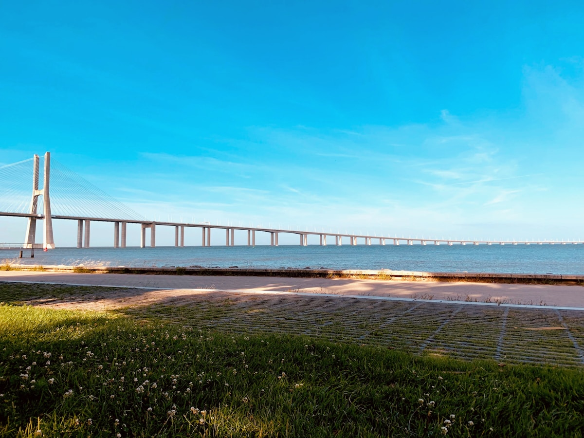 Ponte Vasco da Gama stretching across the Tagus estuary viewed from the south bank near Almada, Portugal